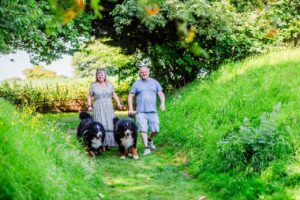 Guests walking dogs at Stanmore Hall Touring Park